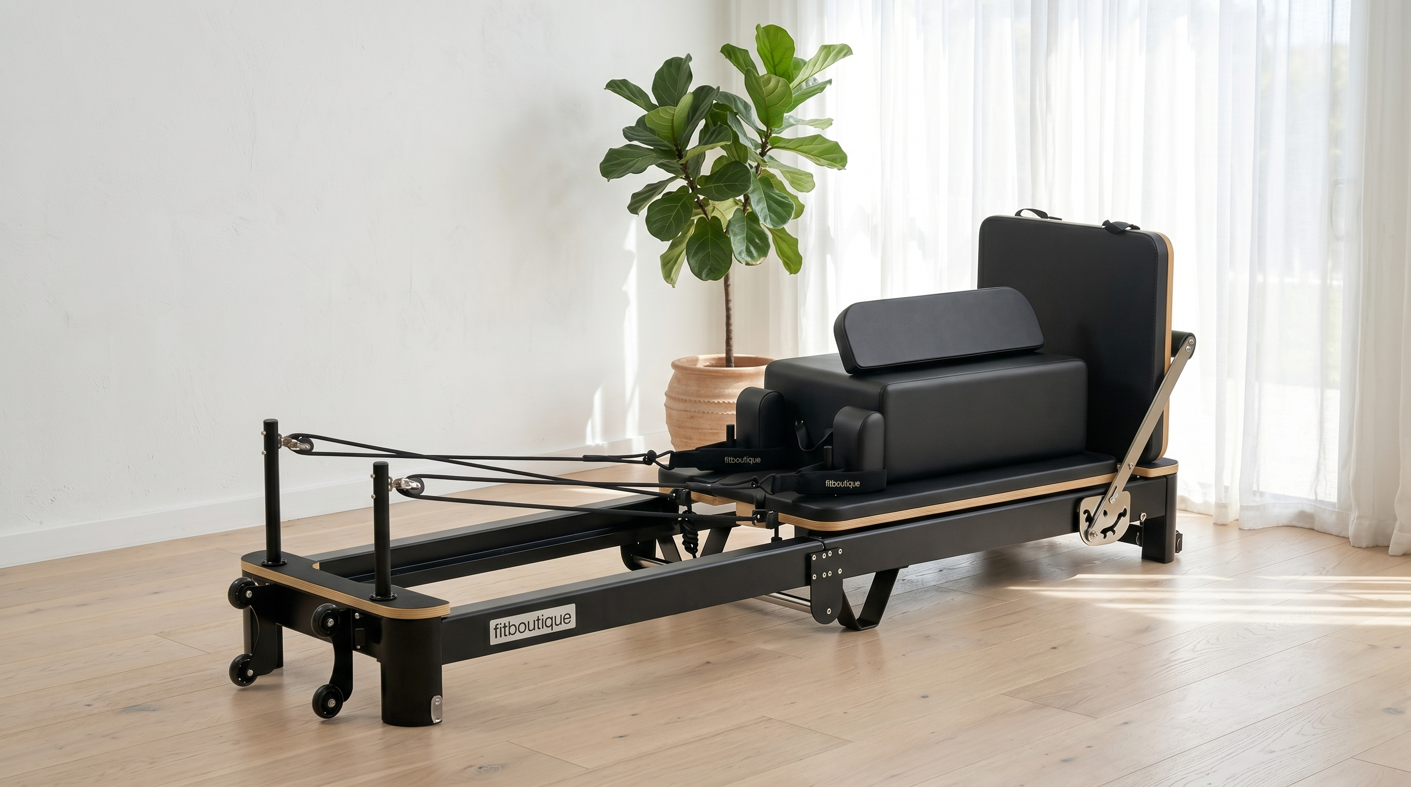 FitBoutique Ivory reformer in a bright airy room